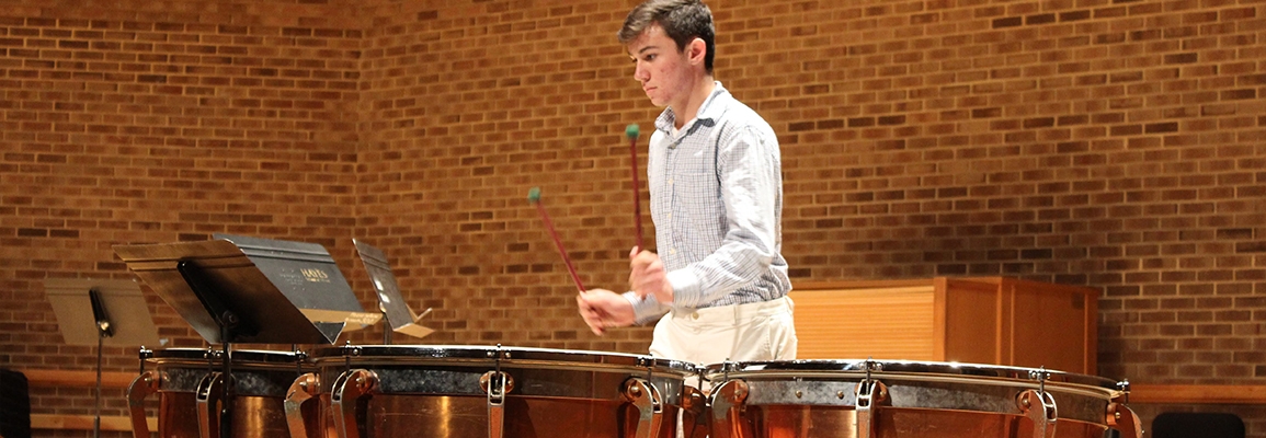 Student playing percussion