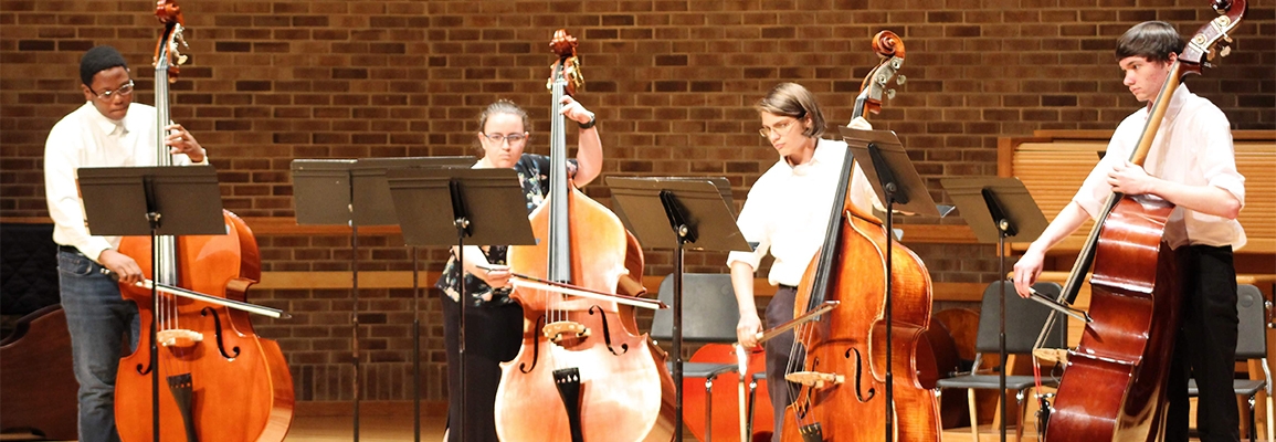 Students playing strings